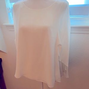 White sheer blouse with overlay flowing sleeves.